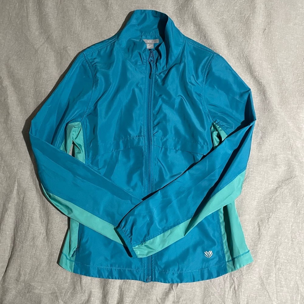 Size small blue light rain/ wind jacket.